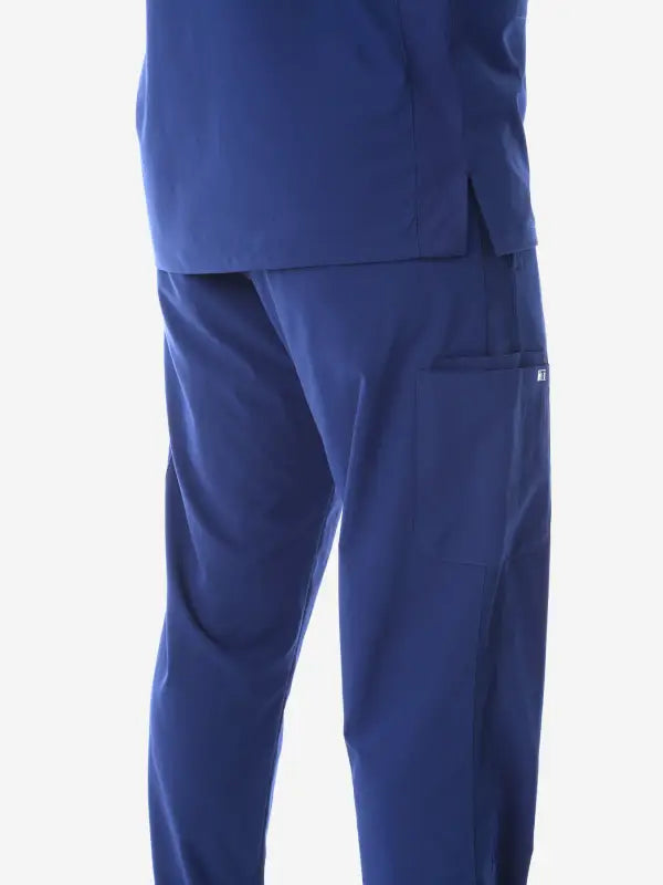 Navy blue medical scrub pants with side pockets for men’s five-pocket scrub style