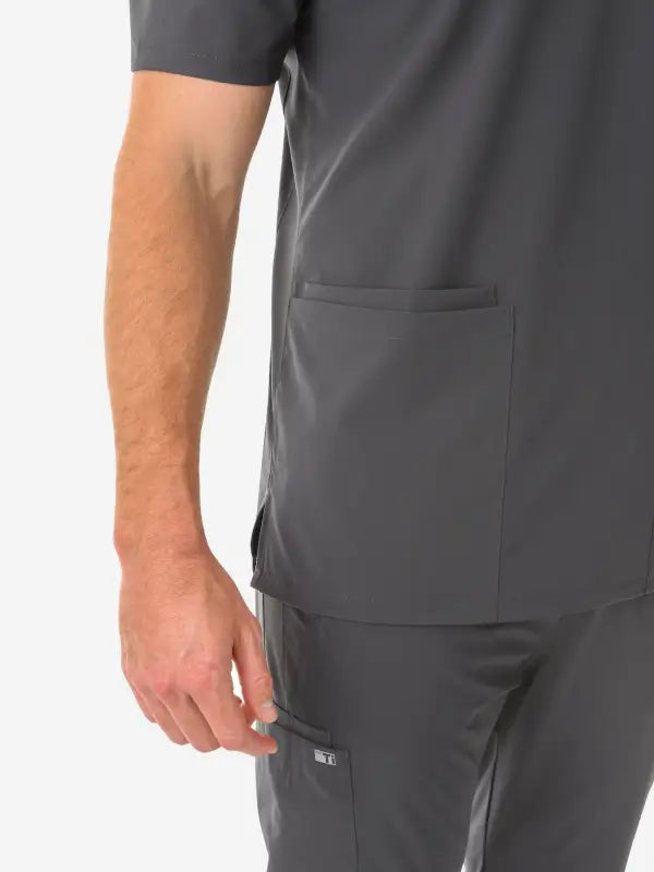 Dark gray men’s five-pocket scrub top featuring a side pocket for convenience