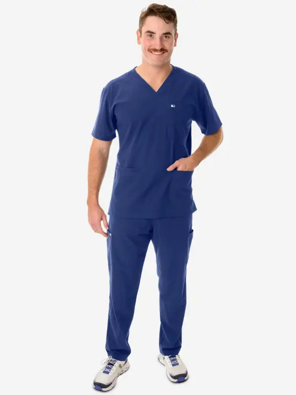 Navy blue men’s five-pocket scrub uniform with v-neck top and matching pants