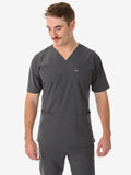 Dark gray men’s five-pocket scrub top with v-neck and front pockets for healthcare professionals