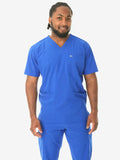 Medical professional in royal blue men’s five-pocket scrub top with v-neck design