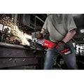Milwaukee M18 FUEL angle grinder with REDLITHIUM High Output HD12 creating sparks during cutting