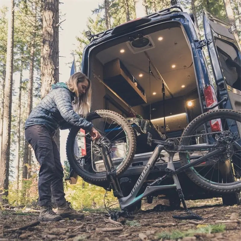 Mountain bike on van rack with Gerber Gear Armbar Drive urban blue pry bar and bottle opener