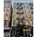 Classic New York City apartment with black fire escape, perfect for firefighter rescue tool