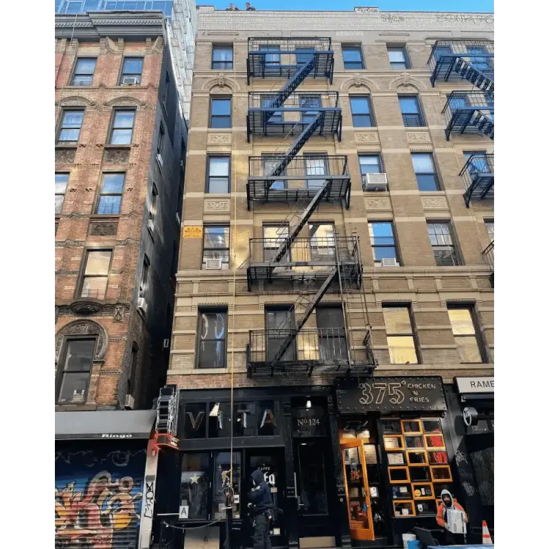 Classic New York City apartment with black fire escape, perfect for firefighter rescue tool