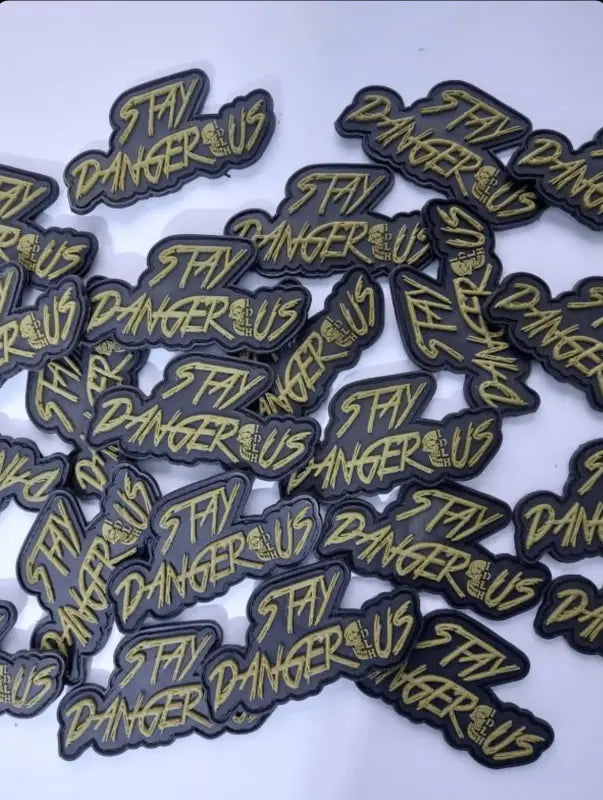 Stay Dangerous PVC Patch for Gear and Vests featuring bold yellow text on black badges
