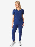Navy blue women’s tuckable one-pocket scrub top with matching jogger pants outfit