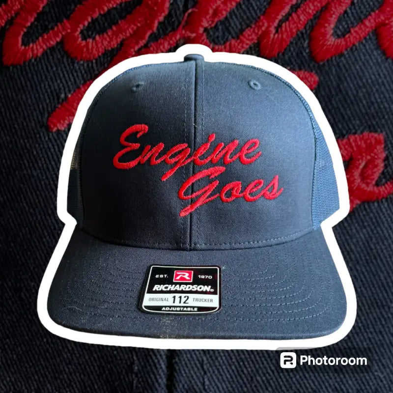 Navy blue Yupoong snapback cap with red Engine Goes text for first responders
