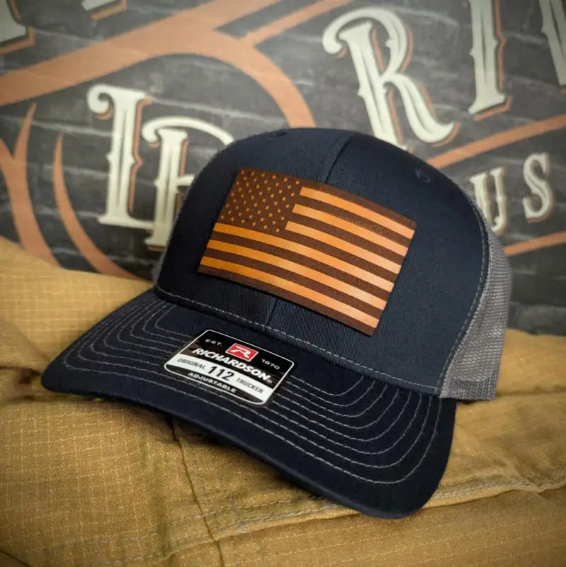 Navy and gray trucker hat with American flag patch and leather patch for various head sizes
