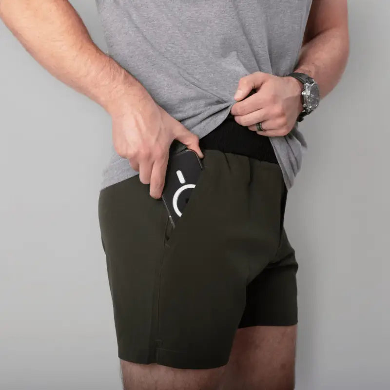 Olive green Carrier Training Shorts Mk.II with 5-inch inseam for concealed carry and training