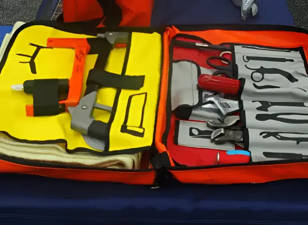 Open orange Crash Bag Kit with tools for emergency rescue and safety preparedness
