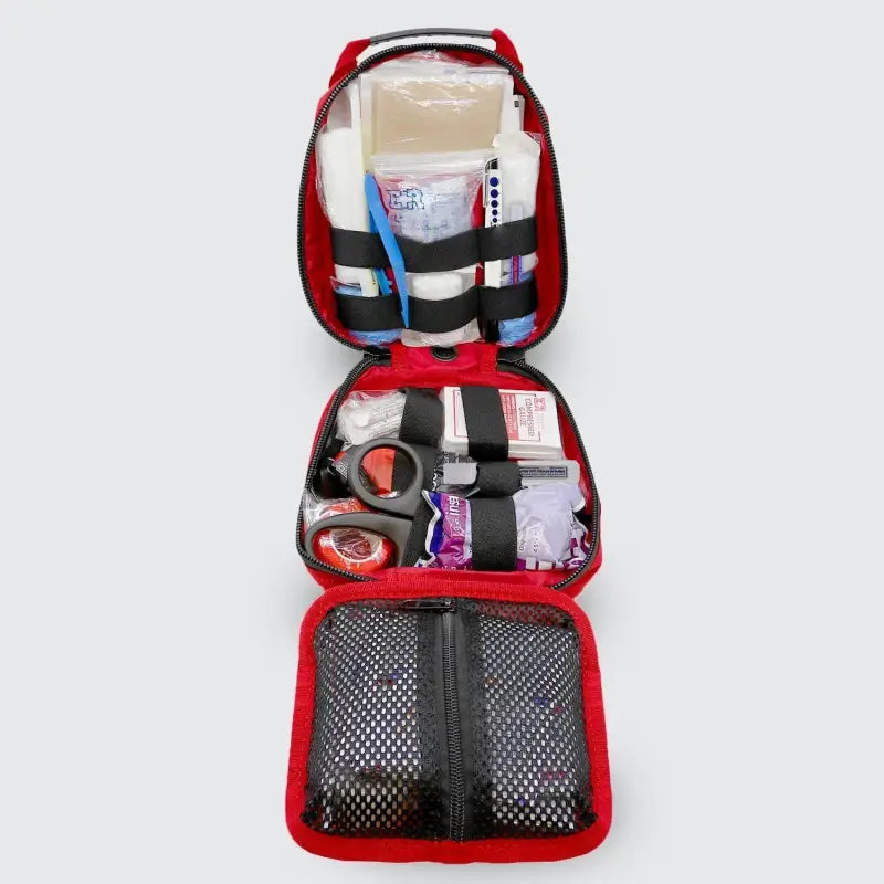 Open red first aid kit for first responders and firefighters in the Small Rip-Away Tactical Trauma Kit