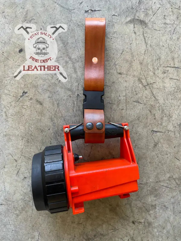 Orange flashlight with leather strap for Box Light Quick and Light Quick purposes