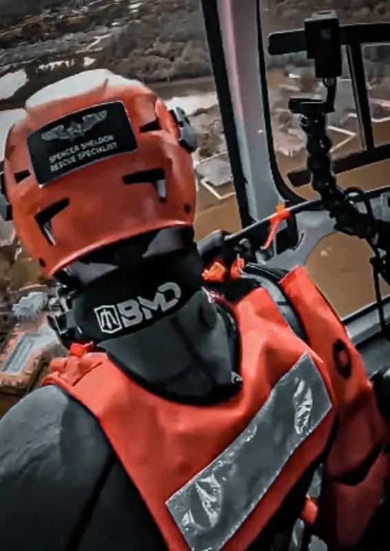 Orange rescue helmet and vest with BMD Mask Strap for safety and visibility
