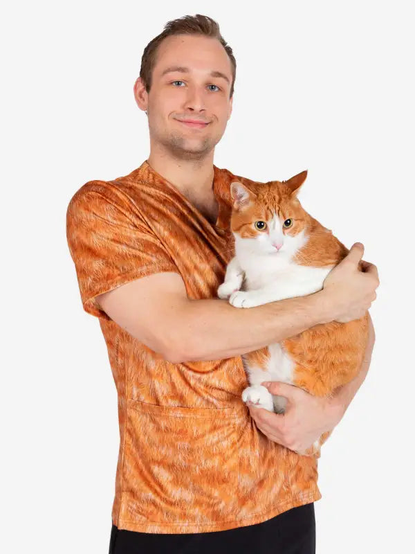 Orange and white cat against an orange shirt in Animal Prints Veterinary Scrub
