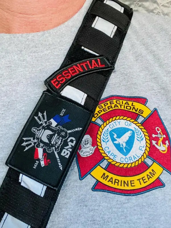 Patches on a black BMD Slap Strap with Solas Tape for First Responders