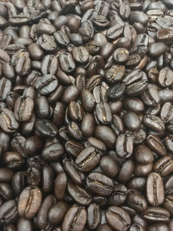 Dark roasted coffee beans from One-Eyed Jack Blend naturally grown for rich flavor