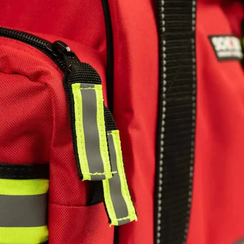 Red backpack with reflective yellow stripes, ideal for EMS trauma bag and professional essentials