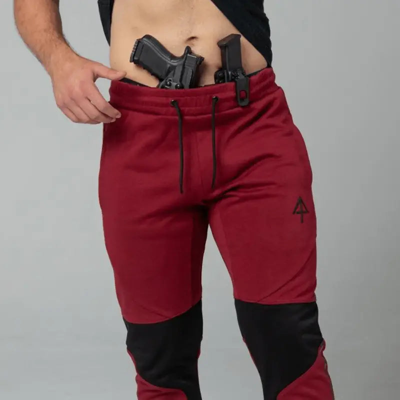 Red and black Carrier Joggers Mk.II with concealed carry, retention belt, and carrier retention