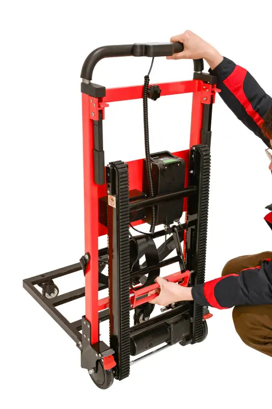 Red and black stair climbing hand truck dolly for easy transport of heavy loads