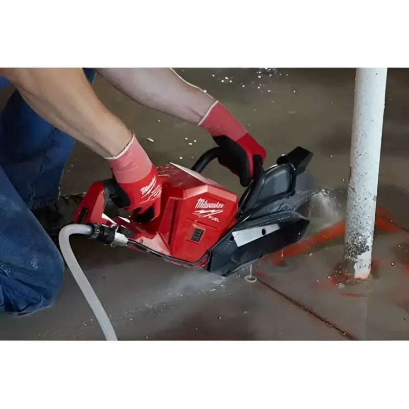 Red M18 FUEL™ concrete saw with water hose, bare tool, perfect for construction projects