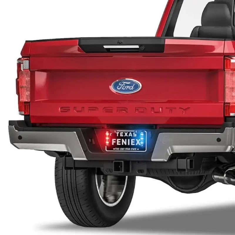 Red Ford Super Duty truck rear with Feniex T3 LED grille warning lights