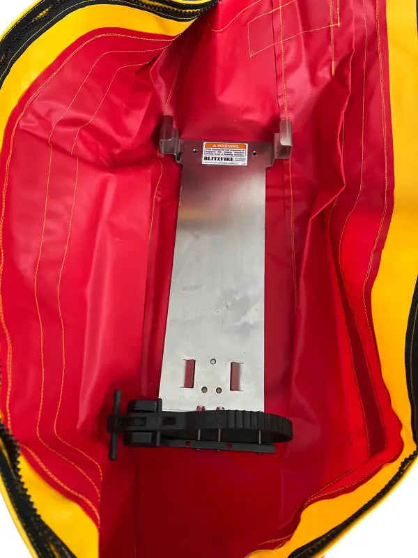 Red and yellow chute with metal mounting bracket on Standard BlitzFire Firefighting Nozzle Cover