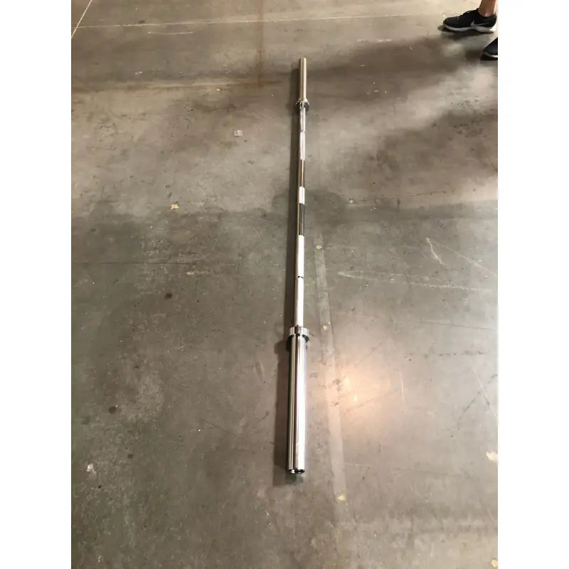 Silver barbell with knurled grip for strength training, ideal Olympic Barbell for first responders
