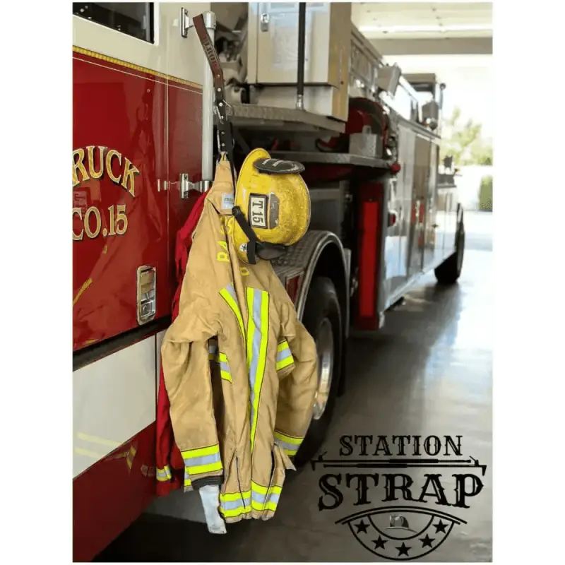 Firefighter turnout gear with reflective stripes on a hook, featuring Station Strap Leather