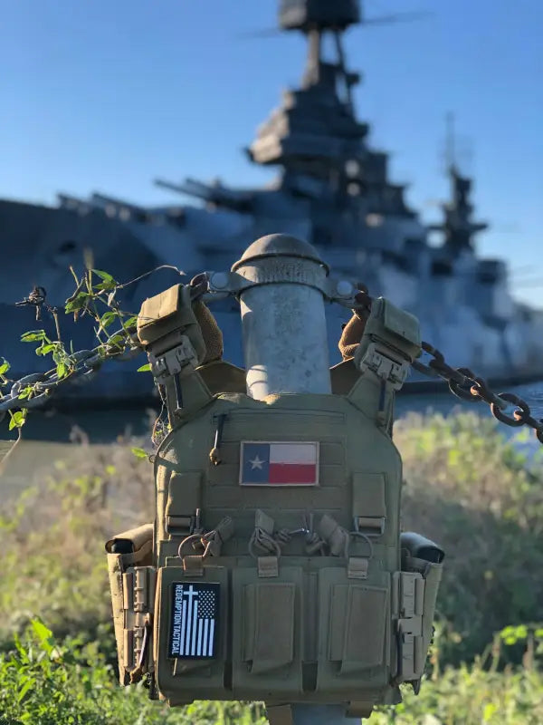 Tan Redemption Tactical Crusader 2.0 plate carrier vest with Texas and Christian flag patches