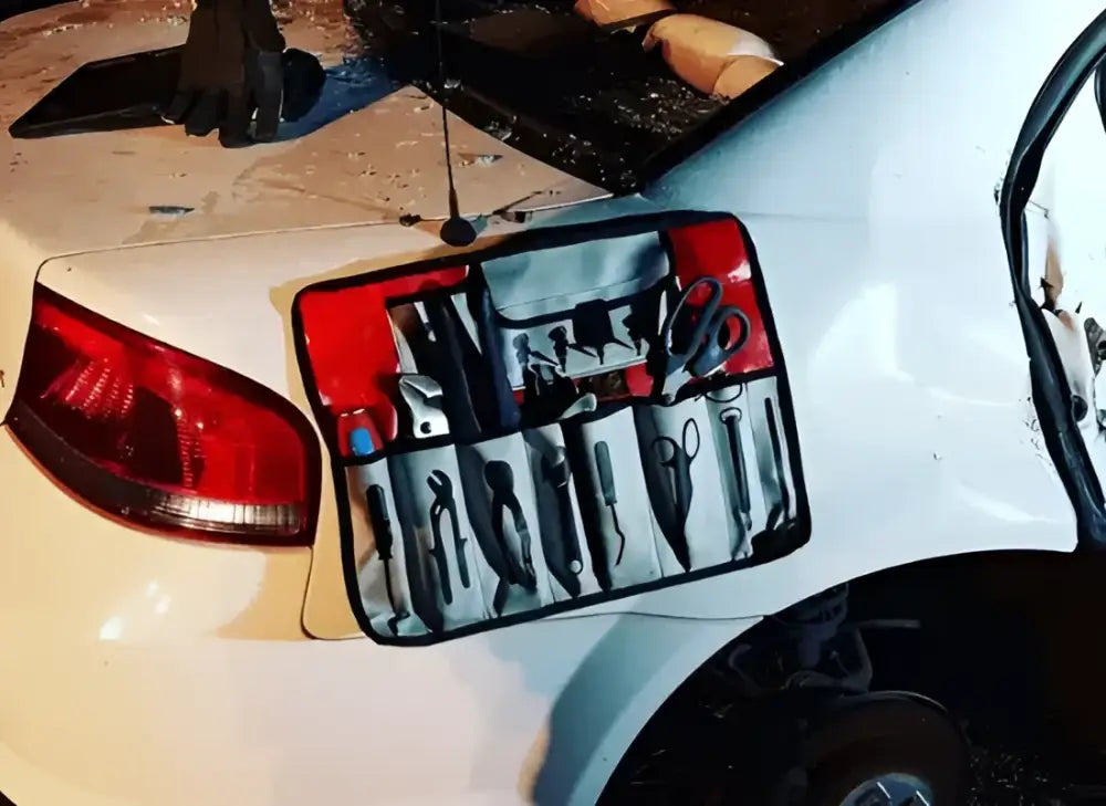 Tool roll attached to a car from the Crash Bag Kit Standard for roadside emergency use