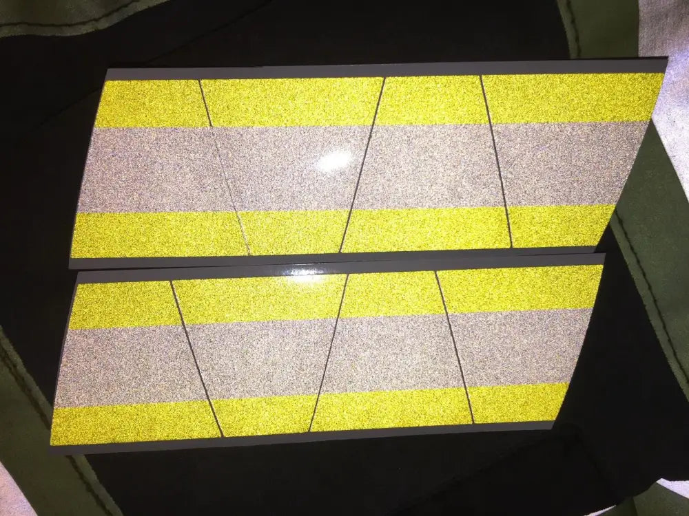 Reflective yellow grey triple stripe panels on Tetrahedron 8 pack helmet