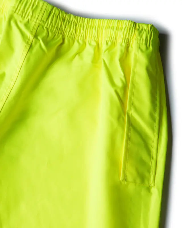 Neon yellow athletic shorts with elastic waistband for UHV823 Hi-Vis Utility Rain Pants
