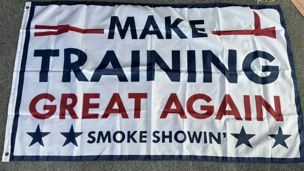White flag with blue and red text Make Training Great Again and decorative stars in training great flag