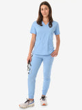 Light blue women’s four-pocket scrub uniform with v-neck top and jogger-style pants