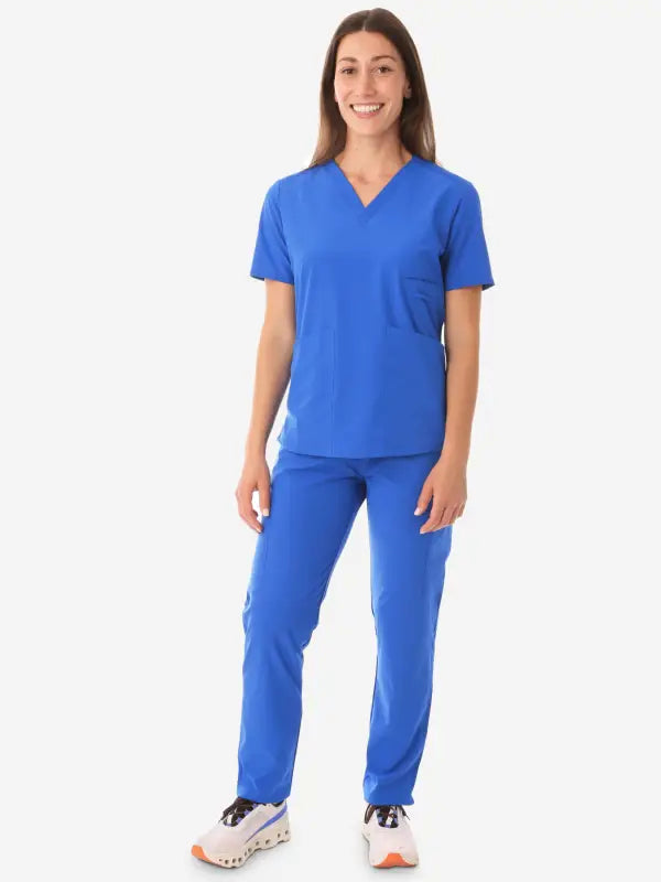 Bright royal blue women’s four-pocket scrub top with matching pants for medical wear