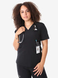 Healthcare worker in women’s four-pocket scrub top with stethoscope and ID badge