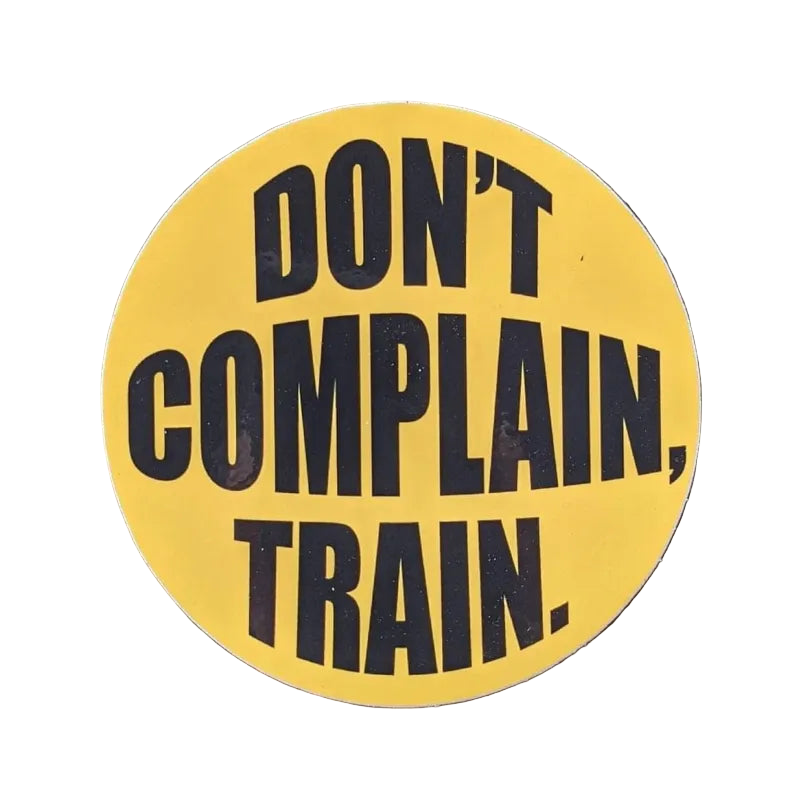 Yellow sign with black text Don’t Complain Train, perfect for firefighters and first responders
