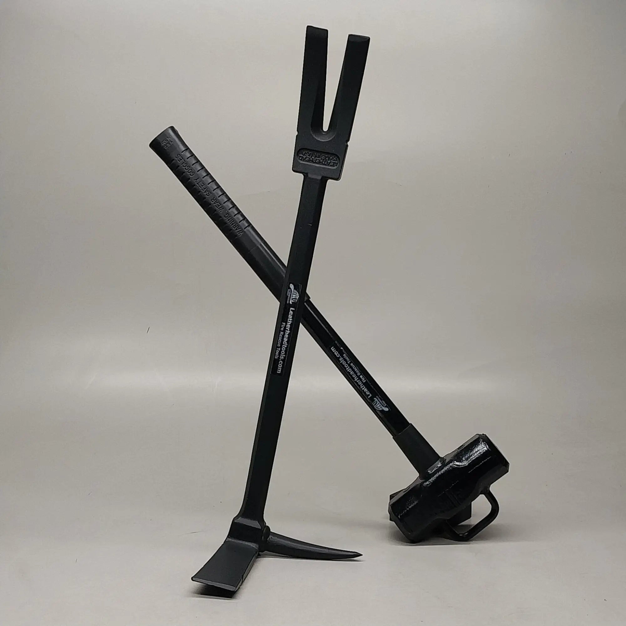 Essential firefighter tools including a Halligan tool and a sledgehammer for rescue and fire suppression operations