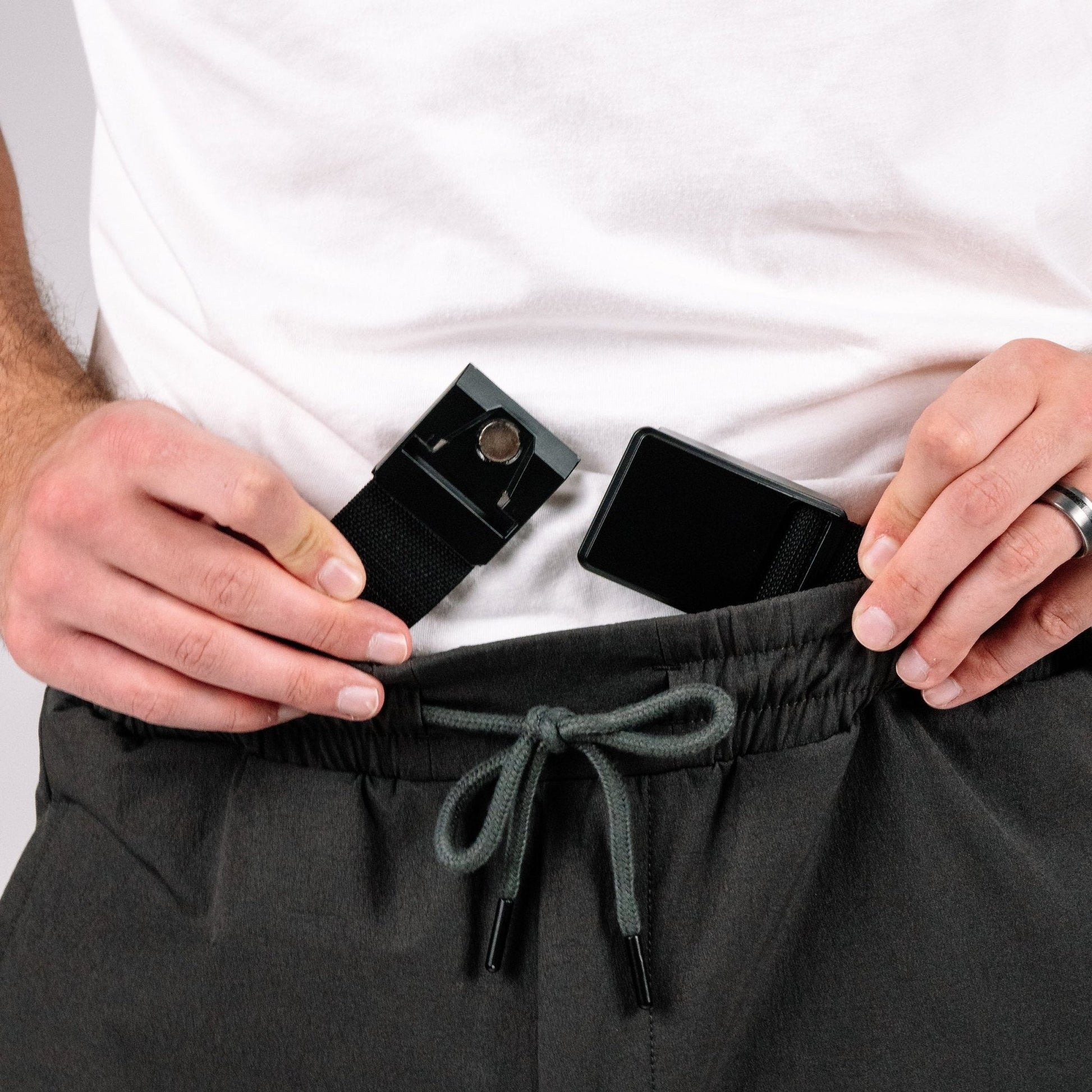 Enhanced Rapid Clasp Retention Belt displayed on a table, demonstrating its lightweight design as a retention belt for concealed carry.