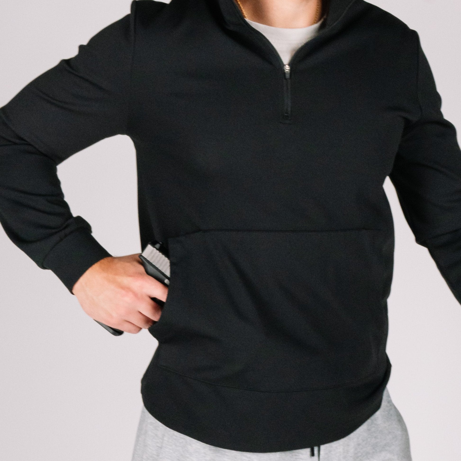 Durable Quarter Zip with minimalist branding, perfect for stealthy concealed carry apparel.