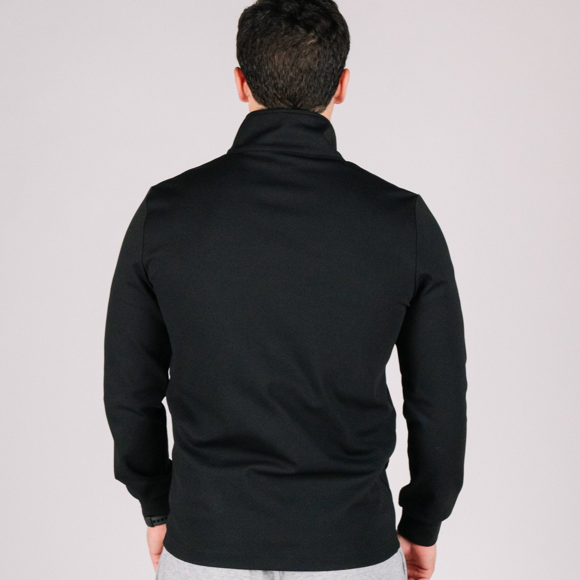 Model wearing the Durable Quarter Zip, demonstrating its practicality for concealed carry apparel.