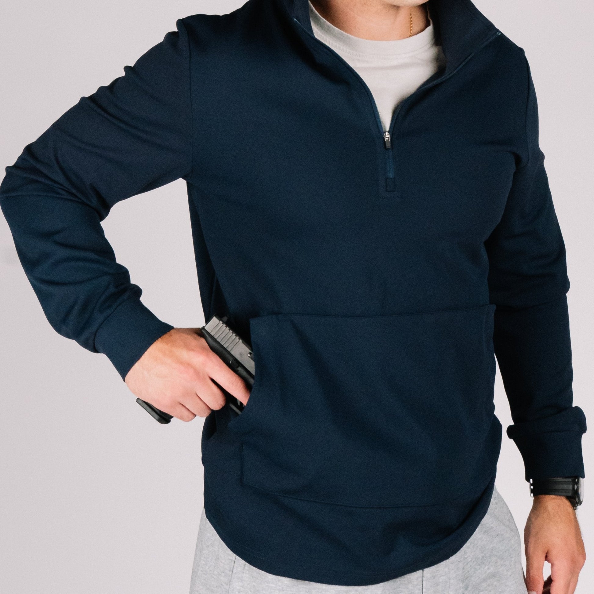 Durable Quarter Zip showcasing snag-resistant fabric, a great choice for concealed carry apparel.