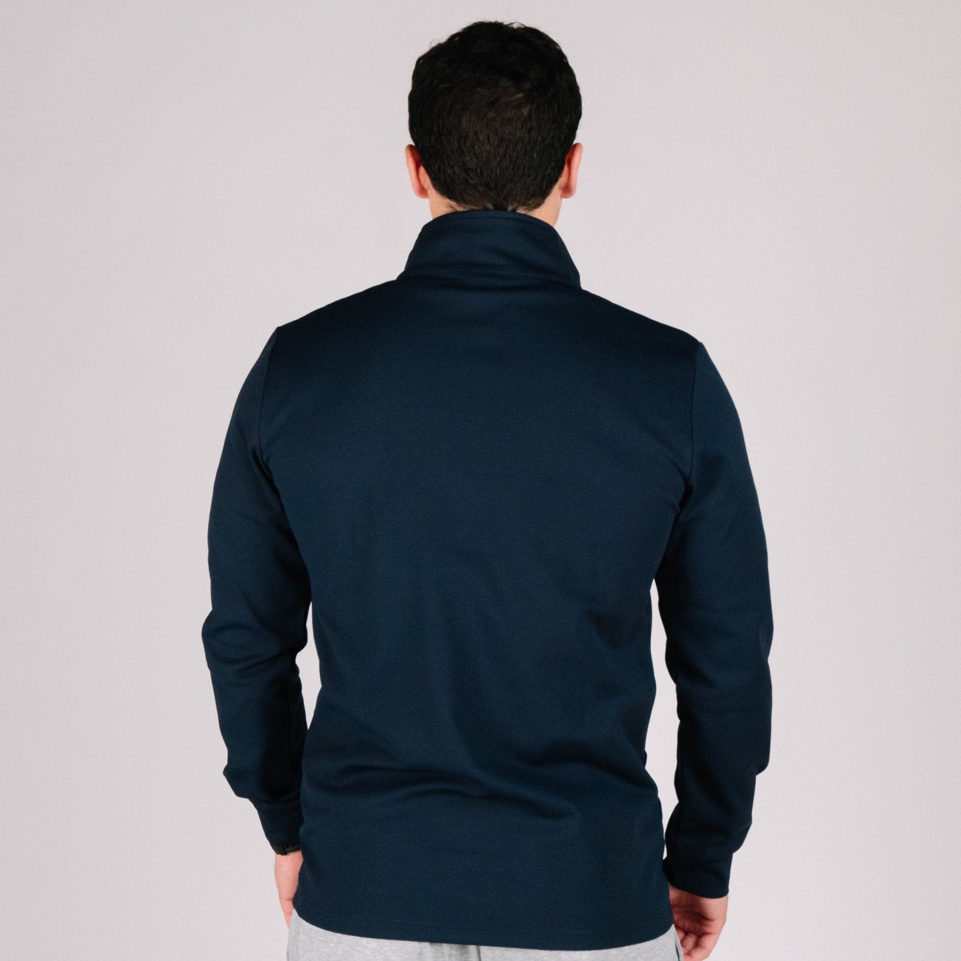 Cuffed sleeves on the Durable Quarter Zip, designed for snag-free draws in concealed carry apparel.