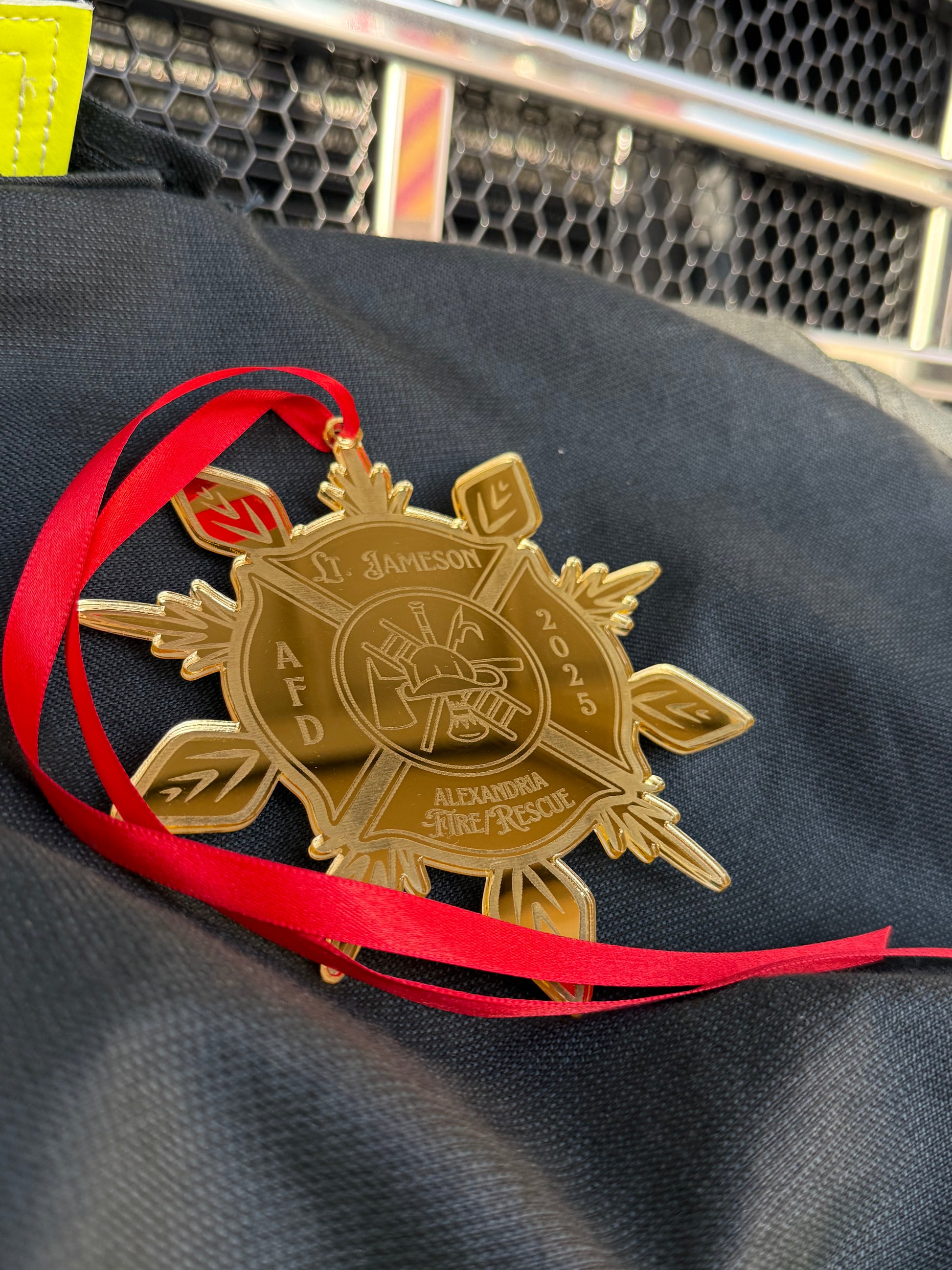 Close-up of the Fire Department Ornament, featuring a stunning reflective finish ideal for holiday decorations.