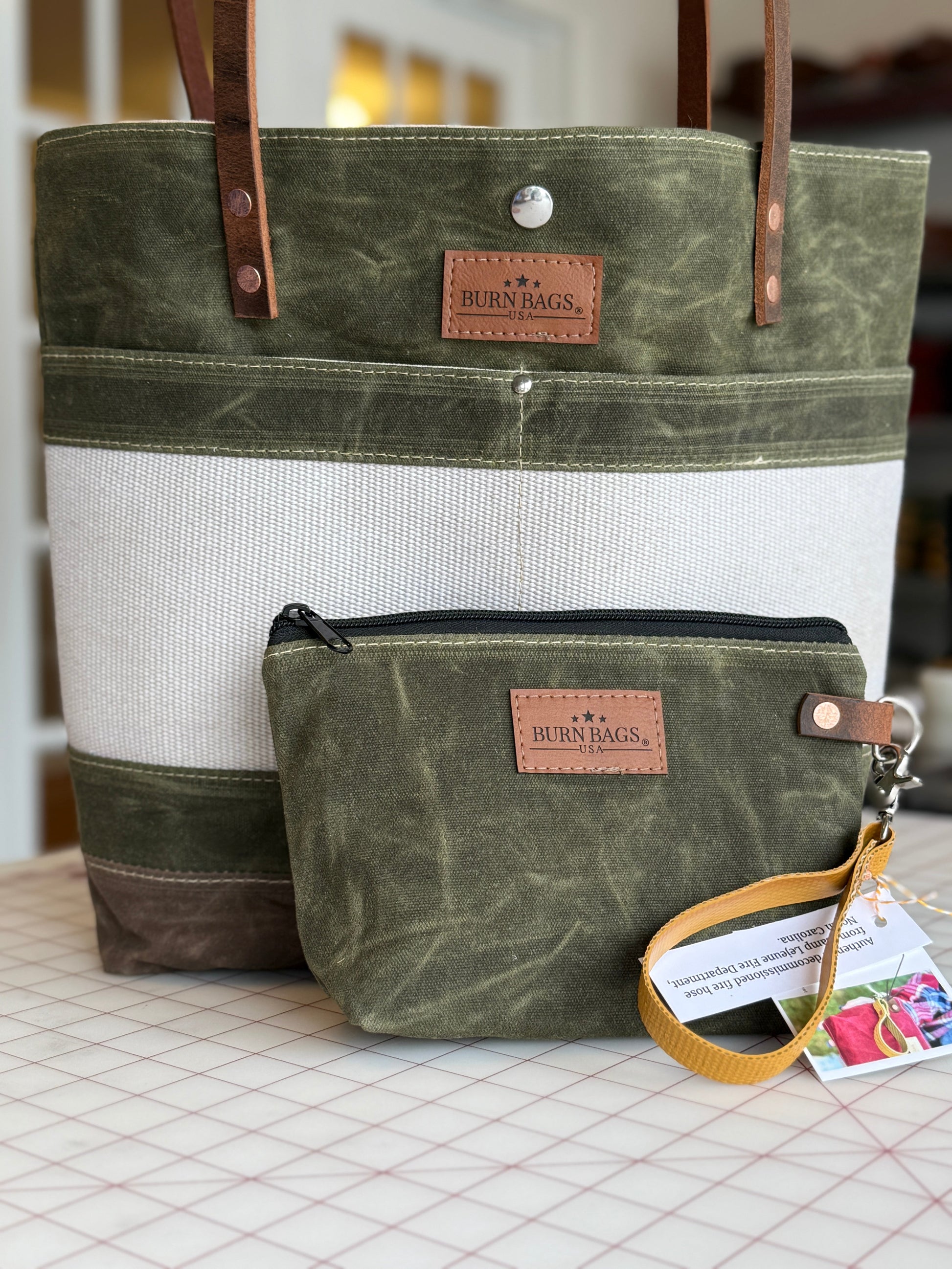 Authenticity card included with the Olive Green Classic Burn Bag, detailing its production number and fire department history, a must-have for classic burn bags collectors.