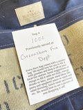 Detailed view of the Olive Green Classic Burn Bag's construction, highlighting the hand-waxed beeswax canvas and unique fire hose wear, perfect for classic burn bags enthusiasts.