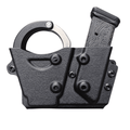 Side view of the Peerless 850 Hinged Cuff and Magazine Holder, highlighting its durable construction and customizable attachment options.