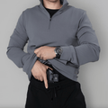 Action shot of the Durable Quarter Zip, perfect for outdoor activities in concealed carry apparel.