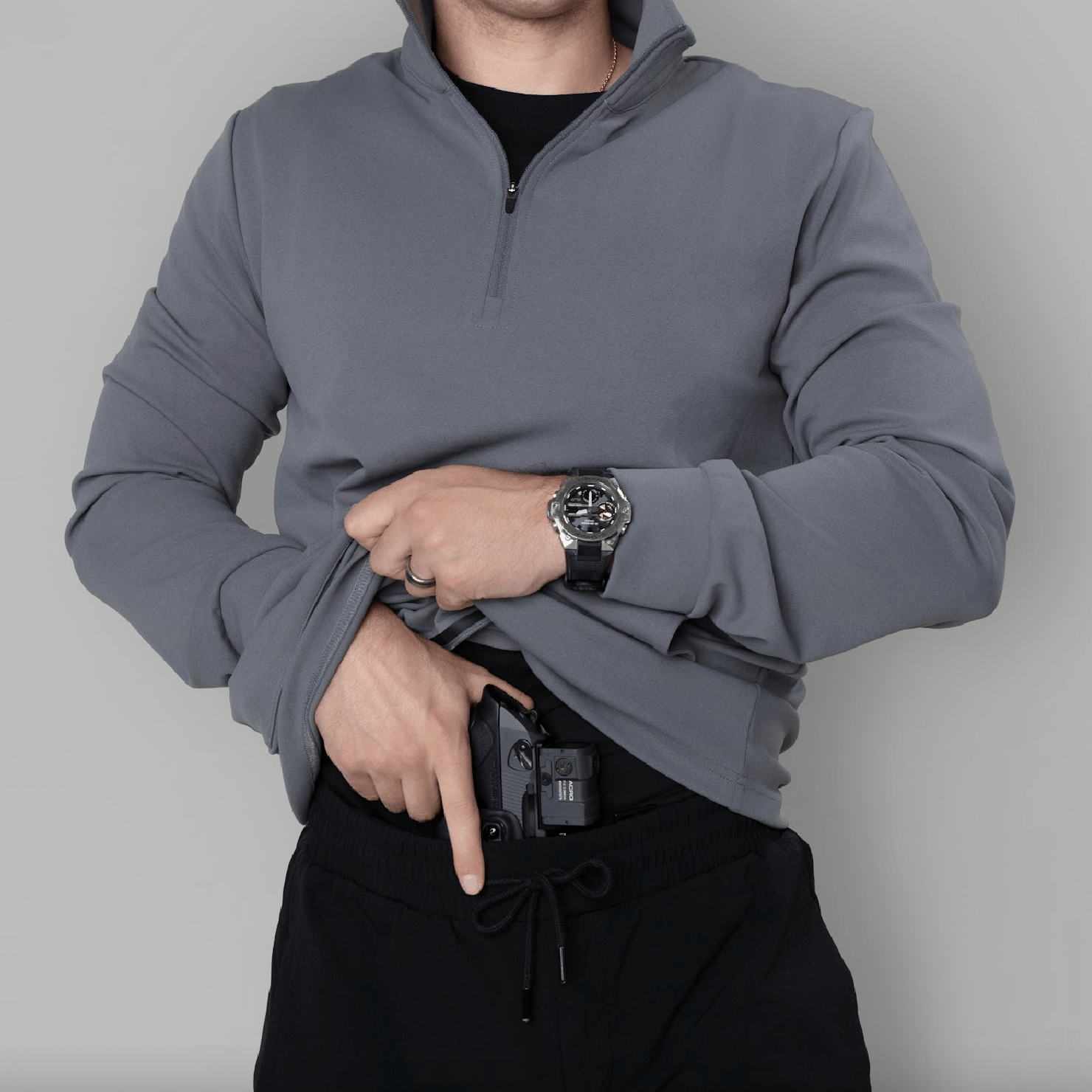 Action shot of the Durable Quarter Zip, perfect for outdoor activities in concealed carry apparel.